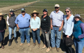 Photo of OFRF staff with staff members at Lakeside Organic Gardens