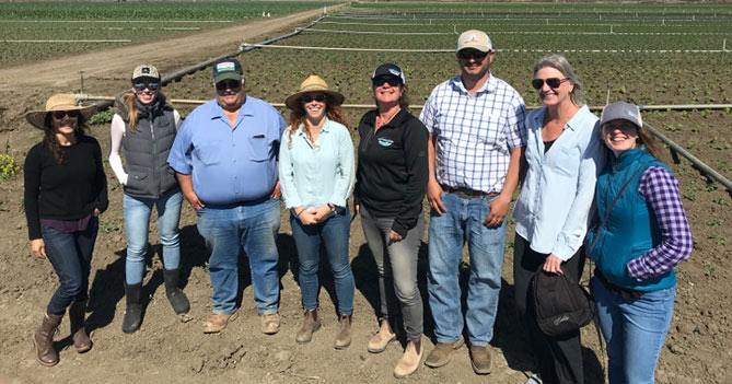 Photo of OFRF staff with staff members at Lakeside Organic Gardens