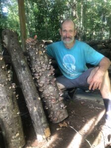 Bryan Hager with mushroom log