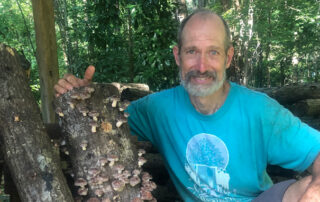 Bryan Hager with mushroom log