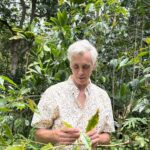Colehour Bondera examining coffee leaf rust disease
