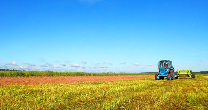 tractor driving across farm fields