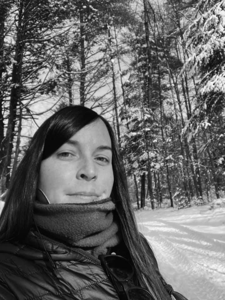 OFRF board member Carrie-Anne Palmeri in the woods in winter, black and white