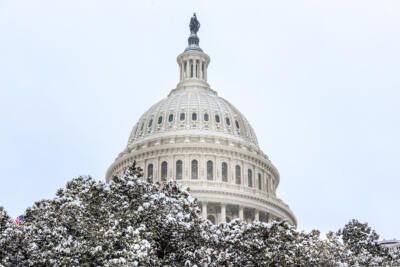 Capitol building, The United States Congress covered with snow in winter time and Capitol hill area covered with snow