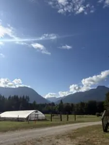 A greenhouse nestled in the mountains.